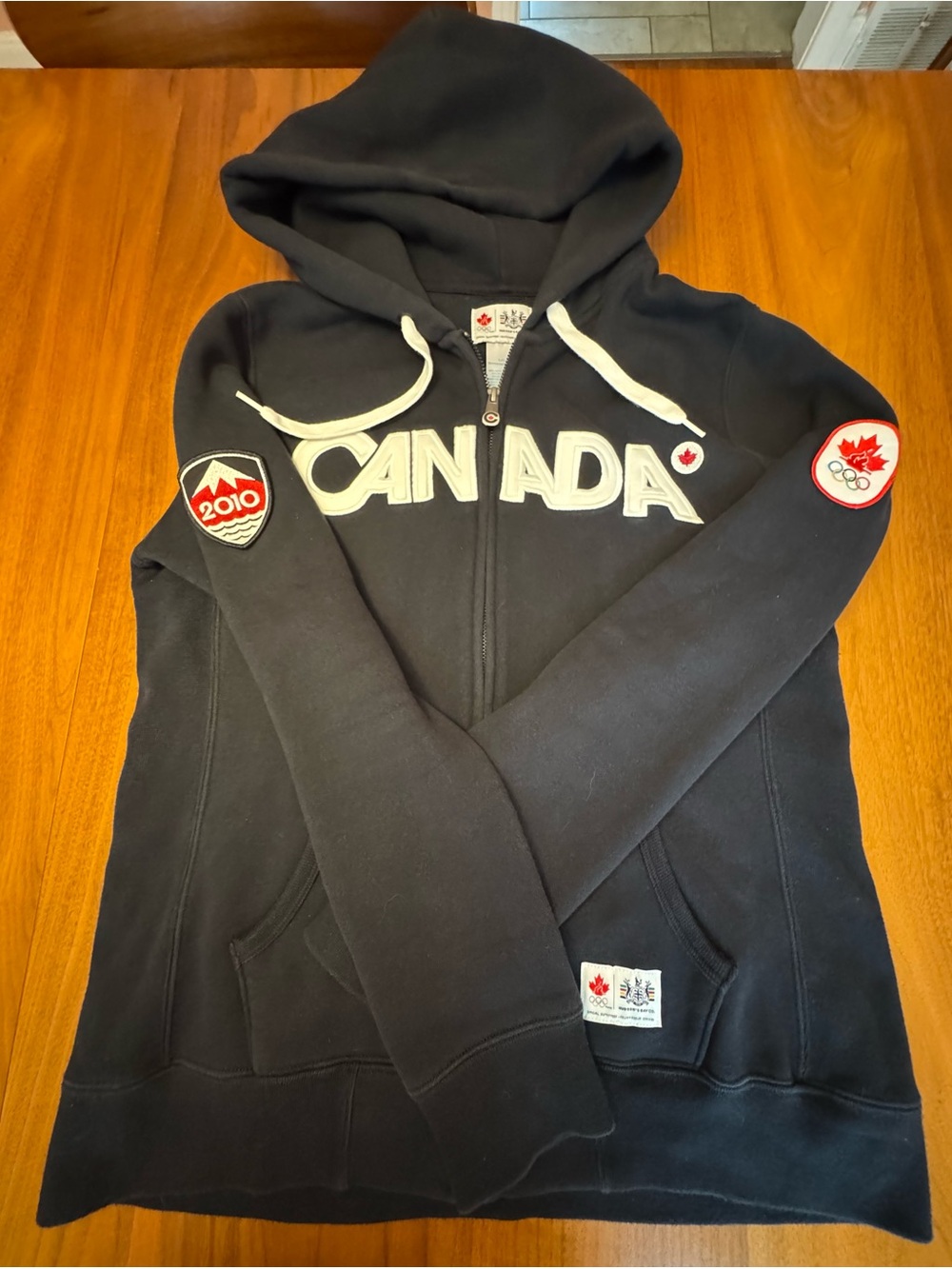 HBC Women’s Official Canada Olympic Black  Zip Hoodie with Patches, Size L